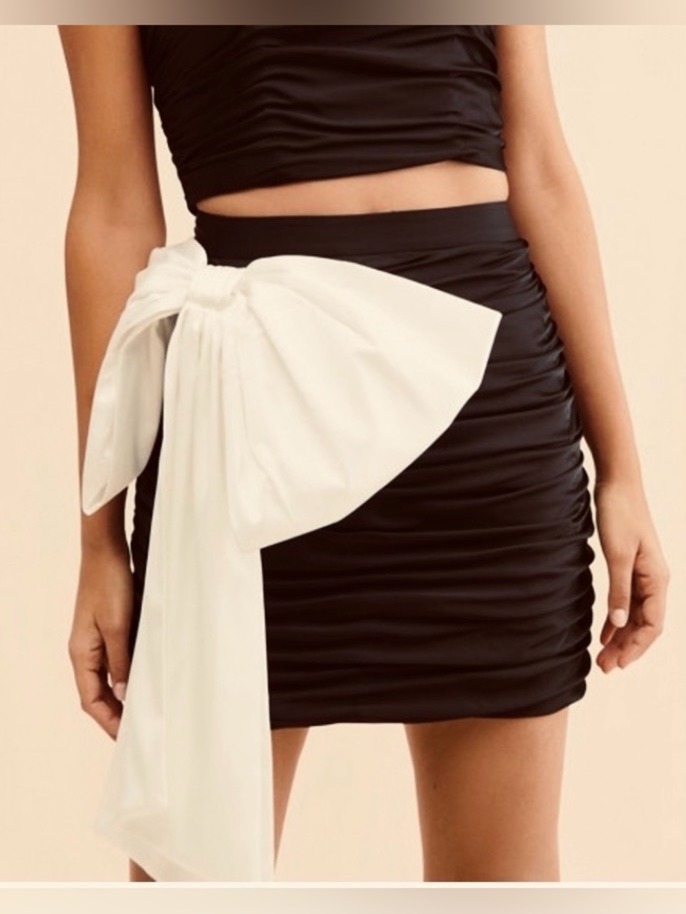 Anthropologie Hutch Ruched Satin Black Mini skirt w/ off-white bow.
